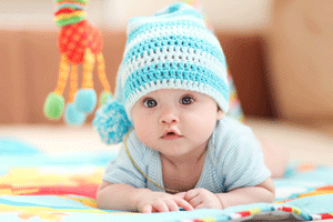 infant daycare program with cure infant in warm hat